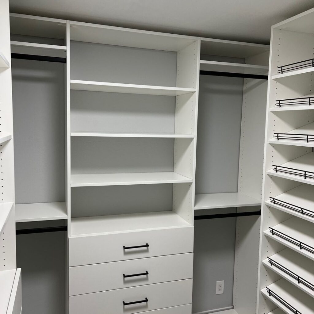 white painted closet shelves and drawers